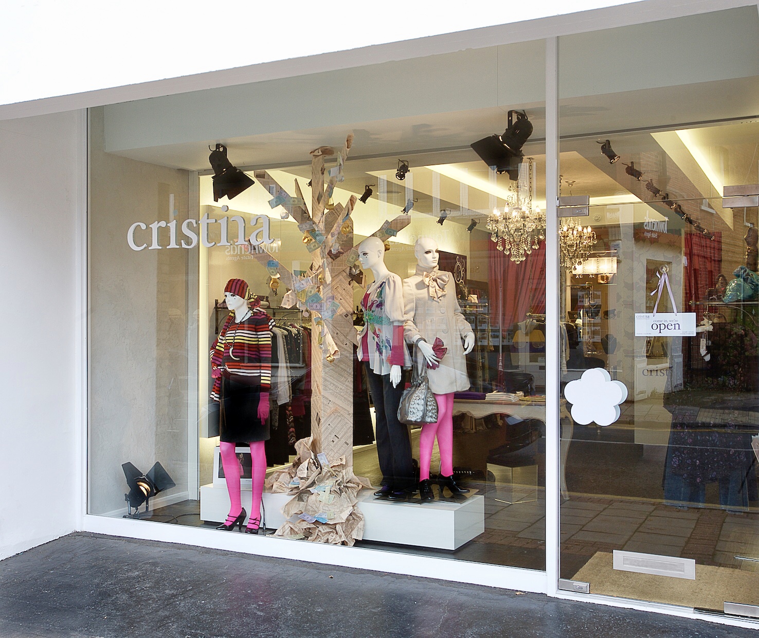 Original Cristina storefront photograph with mannequins, fashion display, signage and reflections.